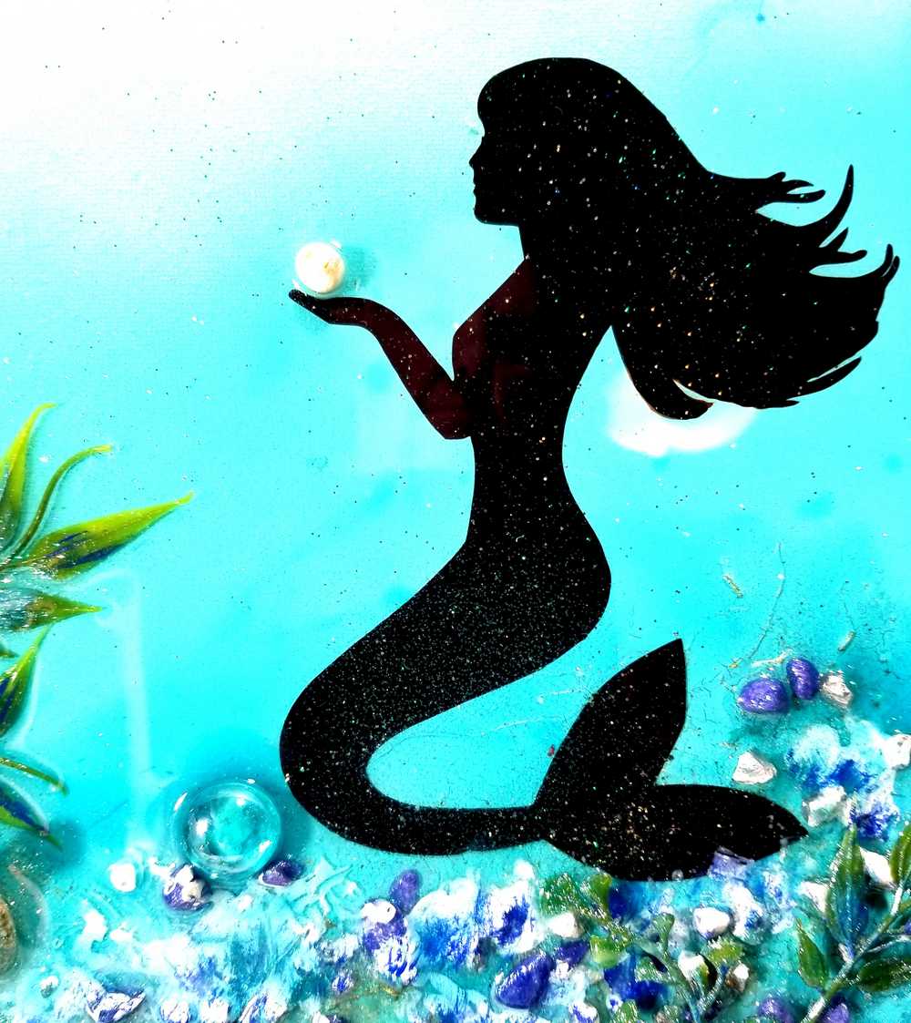 3D Resin Canvas Art of a Beautiful Silhouette of a Mermaid, a Glass Sea Turtle, Seashells, Greenery and Stones