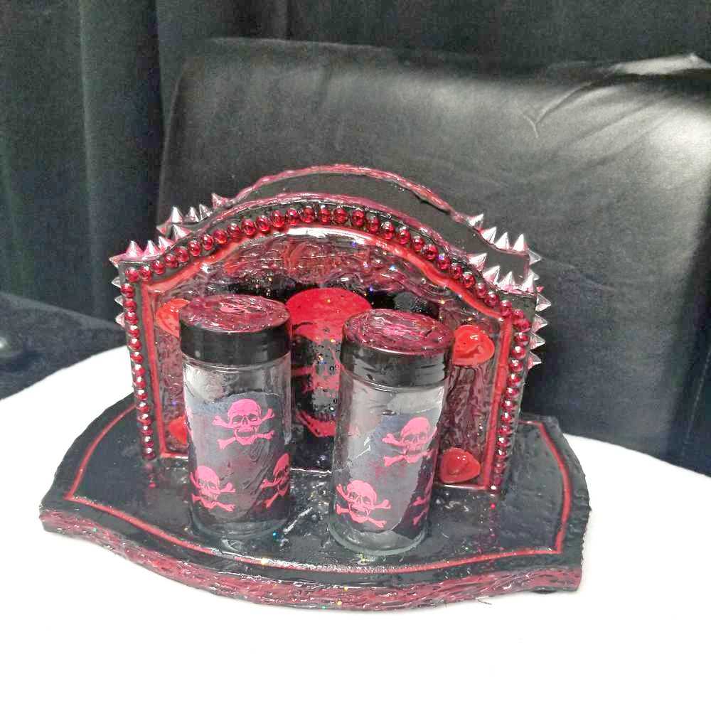 Black & Red Napkin Holder with Salt & Pepper Shakers Decorated with Red Cross & Bones Skull