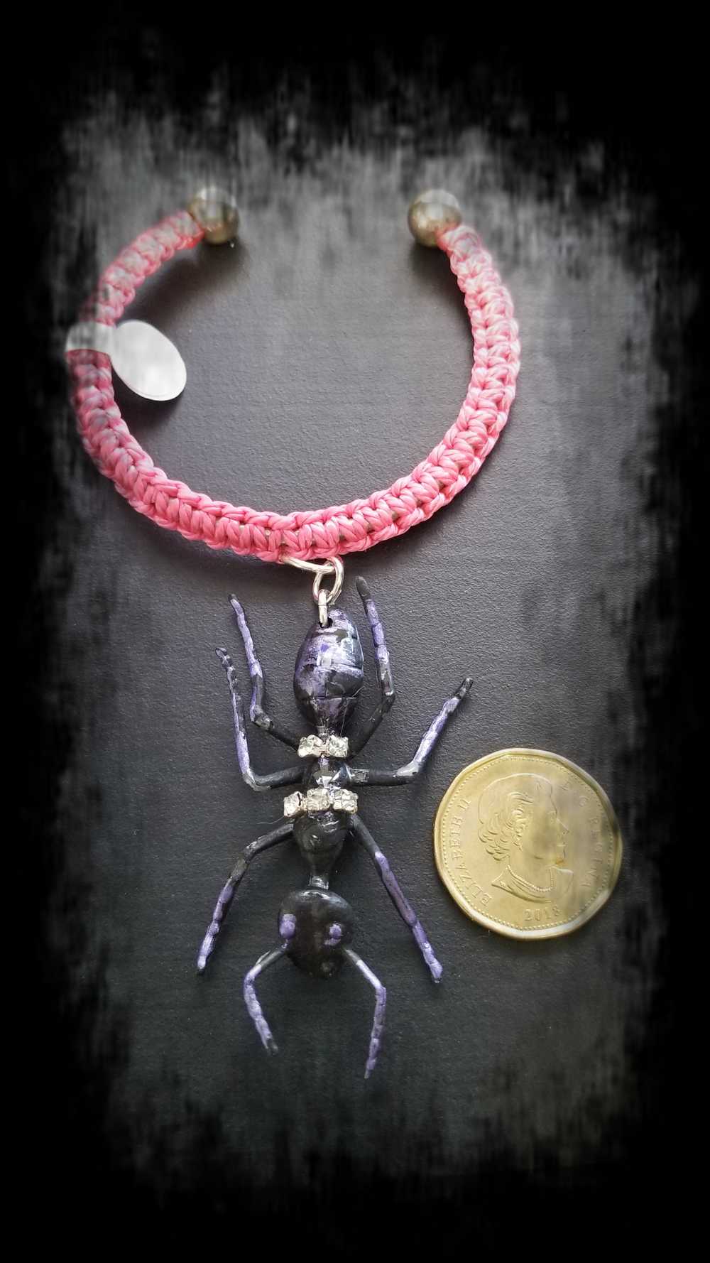 Eerie, Creepy Braided Pink Adjustable Bracelet with an Enormous Black Ant with Hint of Purplle Accents and Clear Rhinestones Across its Back