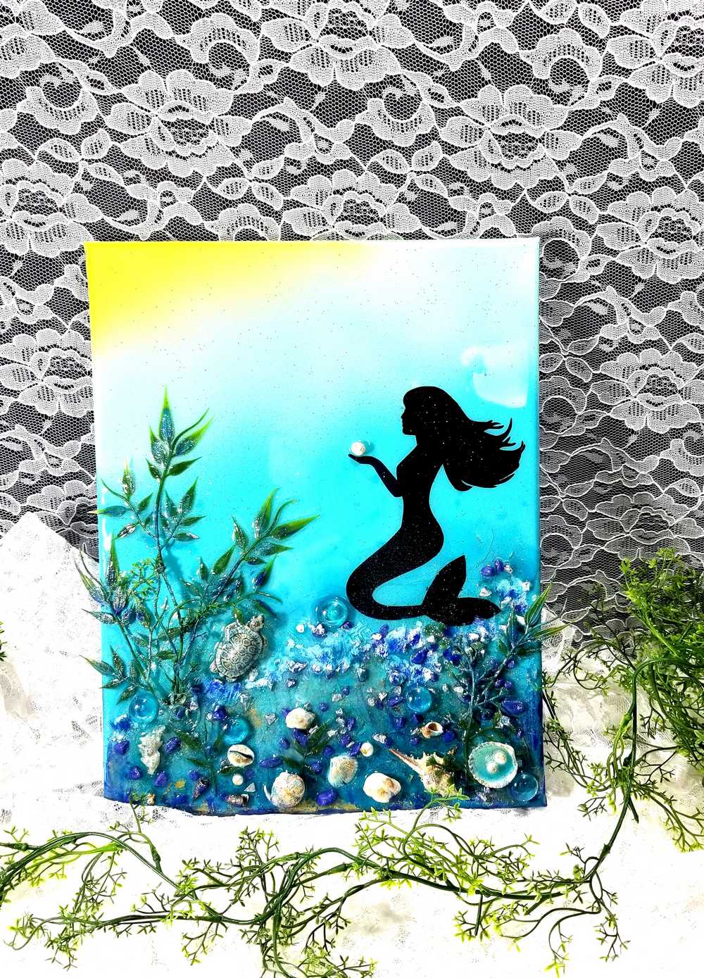 3D Resin Canvas Art of a Beautiful Silhouette of a Mermaid, a Glass Sea Turtle, Seashells, Greenery and Stones