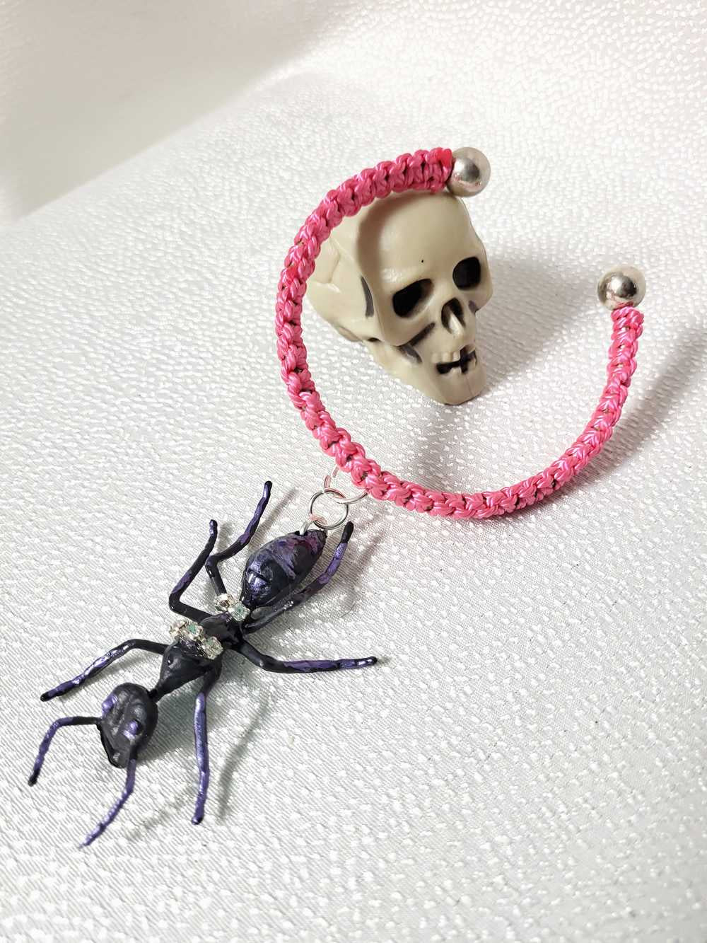 Eerie, Creepy Braided Pink Adjustable Bracelet with an Enormous Black Ant with Hint of Purplle Accents and Clear Rhinestones Across its Back