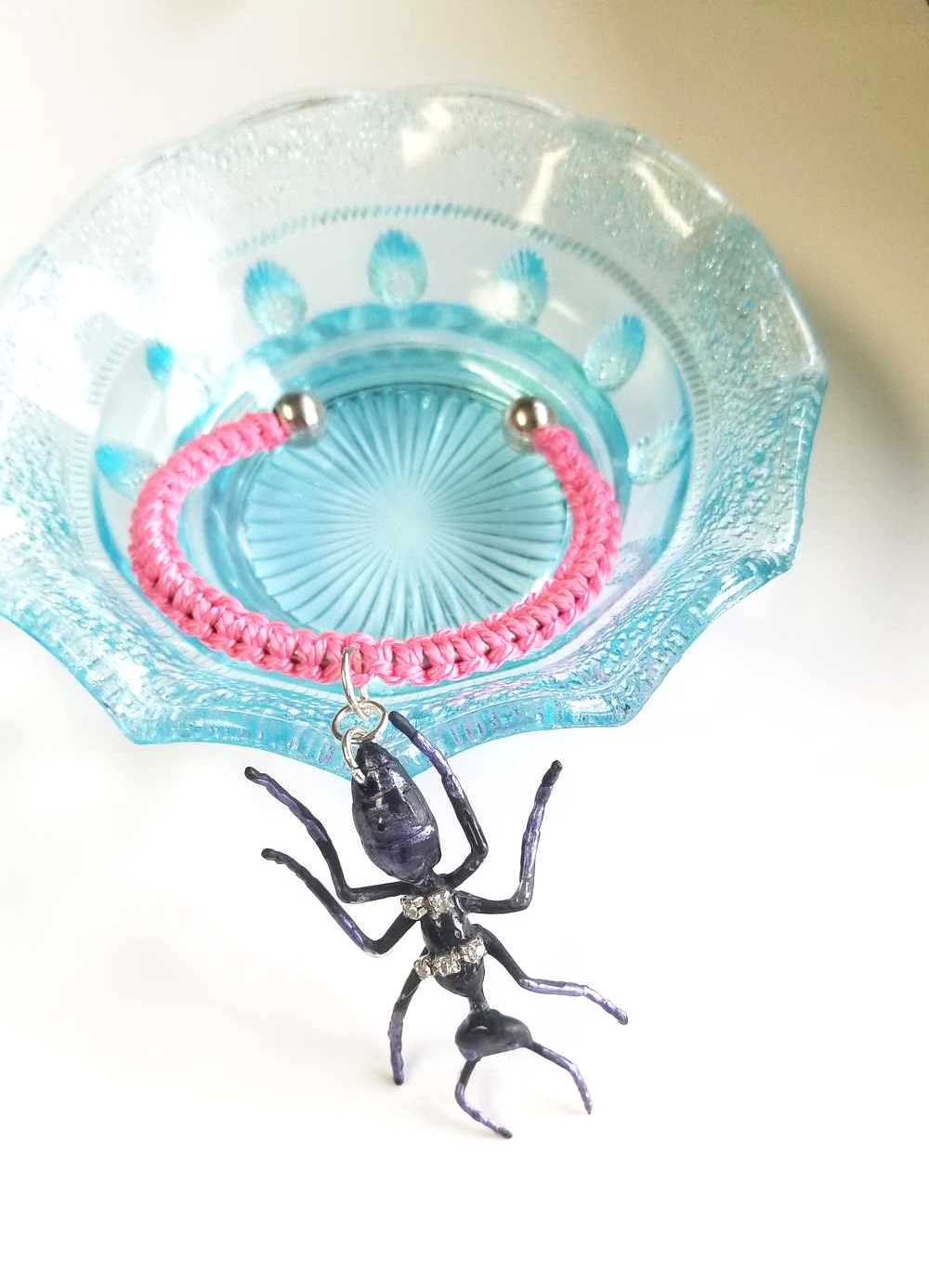 Eerie, Creepy Braided Pink Adjustable Bracelet with an Enormous Black Ant with Hint of Purplle Accents and Clear Rhinestones Across its Back