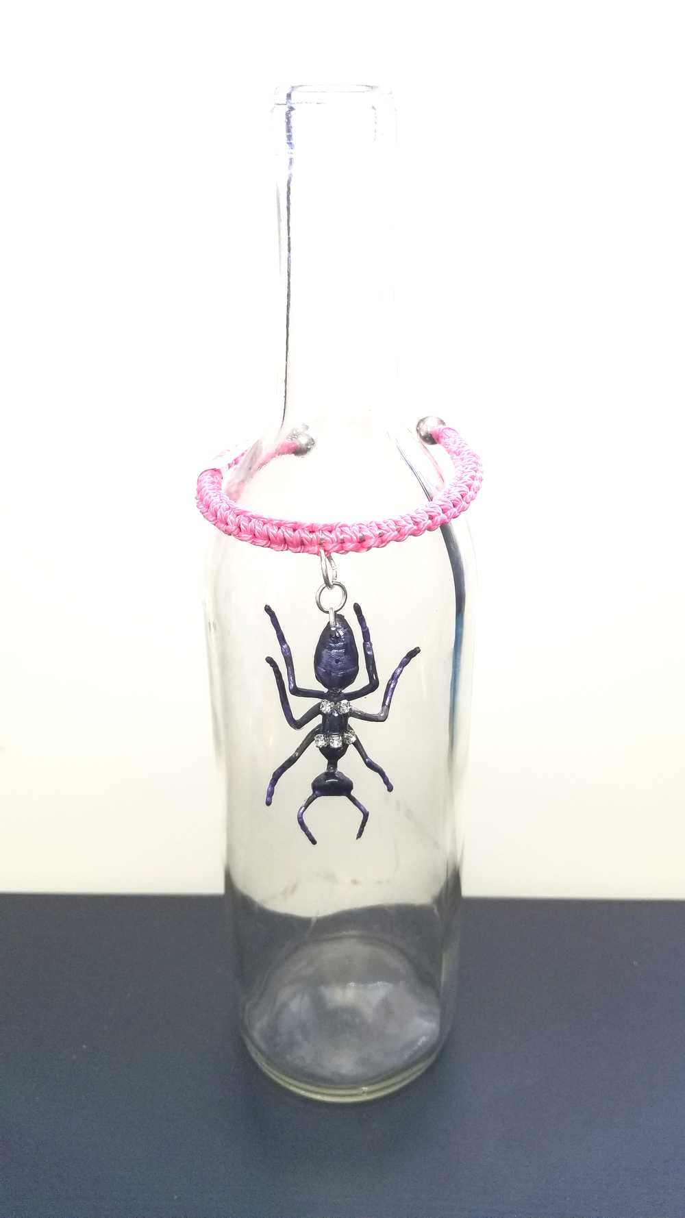 Eerie, Creepy Braided Pink Adjustable Bracelet with an Enormous Black Ant with Hint of Purplle Accents and Clear Rhinestones Across its Back