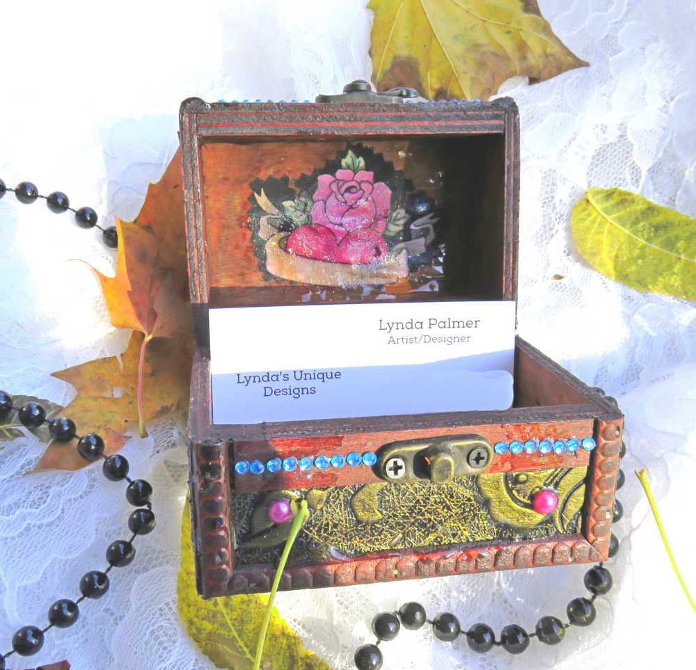 Business Card Holder like no other.  Fabric Skull with Wings Wearing a Burgundy Head Scarf