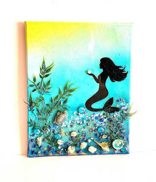 3D Resin Canvas Art of a Beautiful Silhouette of a Mermaid, a Glass Sea Turtle, Seashells, Greenery and Stones
