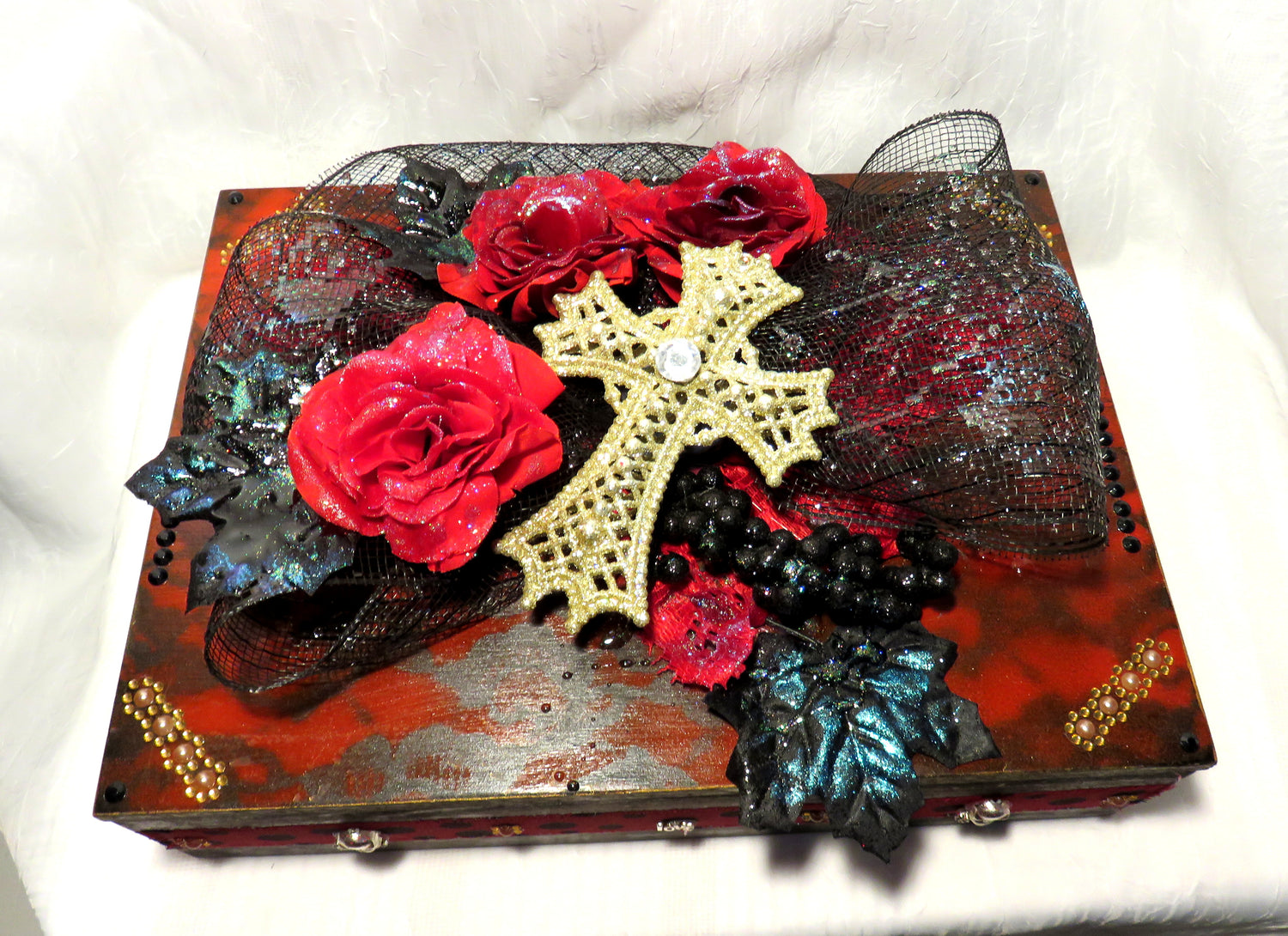 Beautiful Black and Red Box, with Red Roses, Black Leaves, Berries and Netting and Skull Charms. Peek Inside for for a cool Message.Red Roses, Black Leaves and Berries and