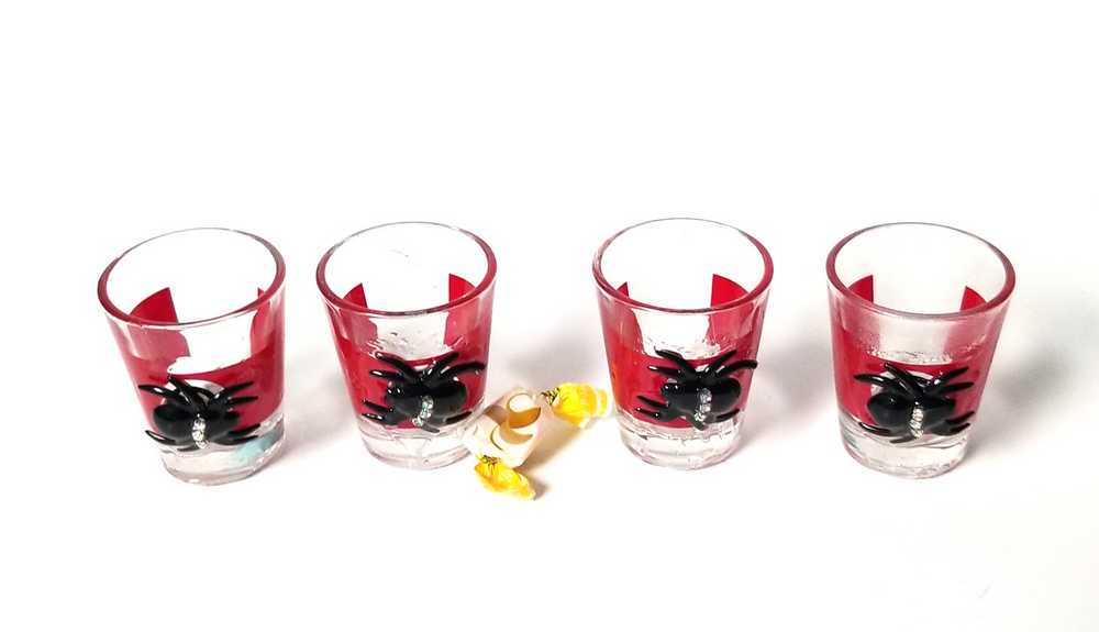 4 Shot Glasses in Red with Black Spiders with Rhinestones