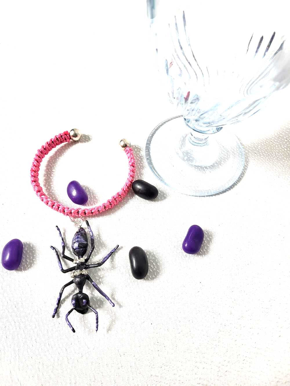 Eerie, Creepy Braided Pink Adjustable Bracelet with an Enormous Black Ant with Hint of Purplle Accents and Clear Rhinestones Across its Back