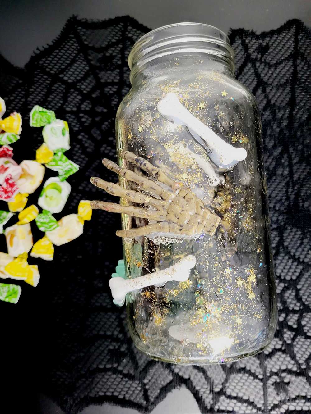 1 litre Mason Jar Filled with Hard Candy. With a Wooden Lid with Resin Skulls & a Cross