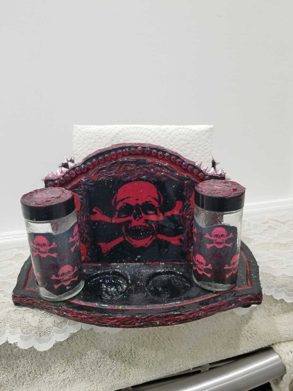 Black & Red Napkin Holder with Salt & Pepper Shakers Decorated with Red Cross & Bones Skull