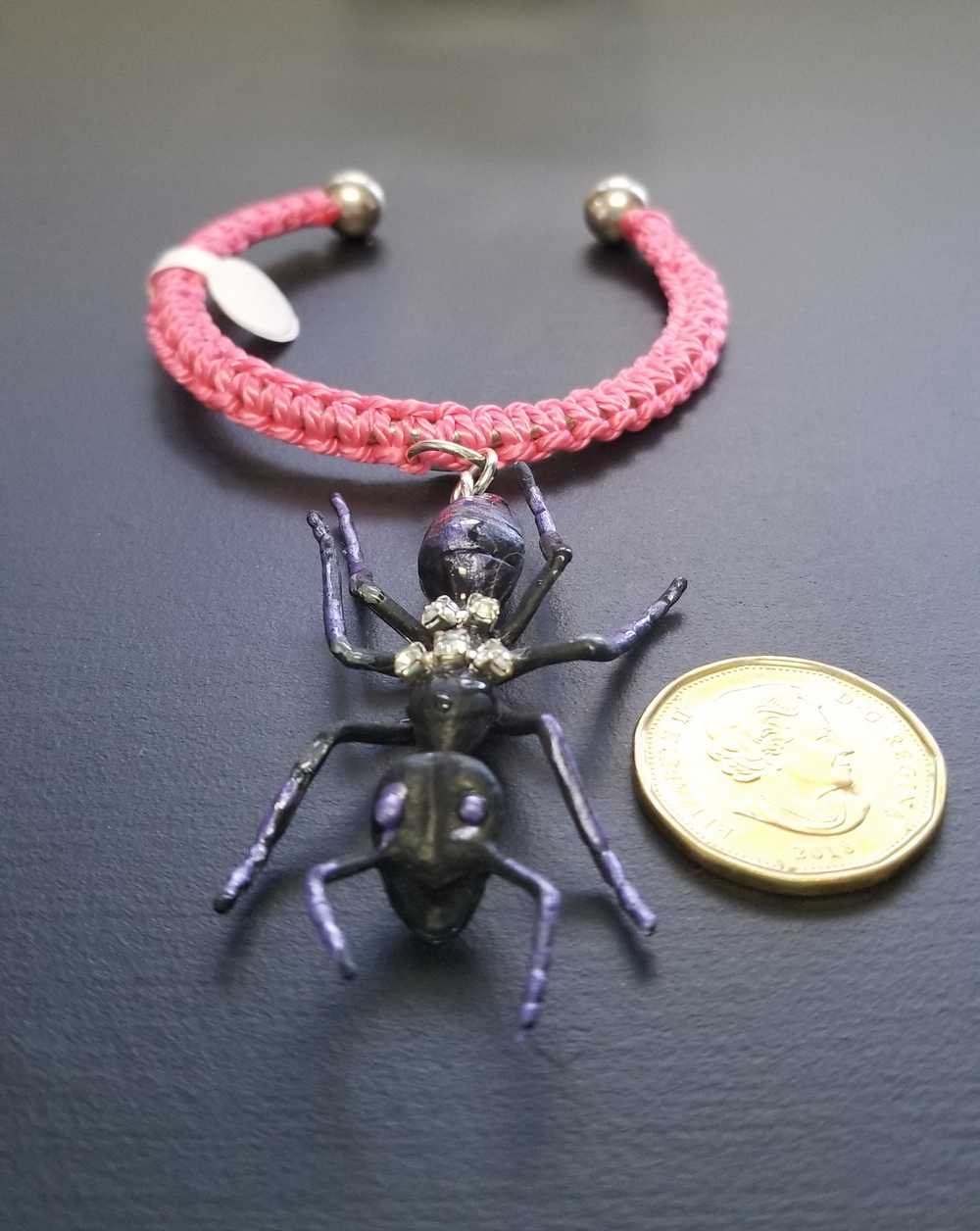 Eerie, Creepy Braided Pink Adjustable Bracelet with an Enormous Black Ant with Hint of Purplle Accents and Clear Rhinestones Across its Back