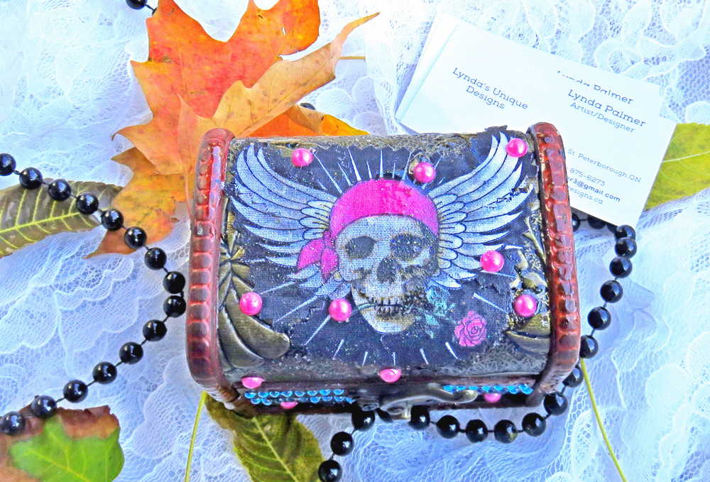 Business Card Holder like no other. Fabric Skull with Wings Wearing a Burgundy Head Scarf