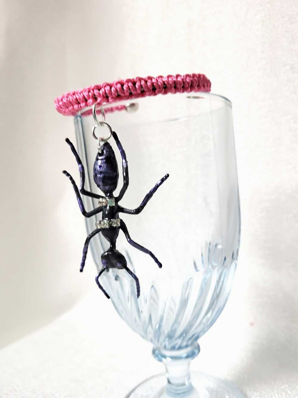 Eerie, Creepy Braided Pink Adjustable Bracelet with an Enormous Black Ant with Hint of Purplle Accents and Clear Rhinestones Across its Back