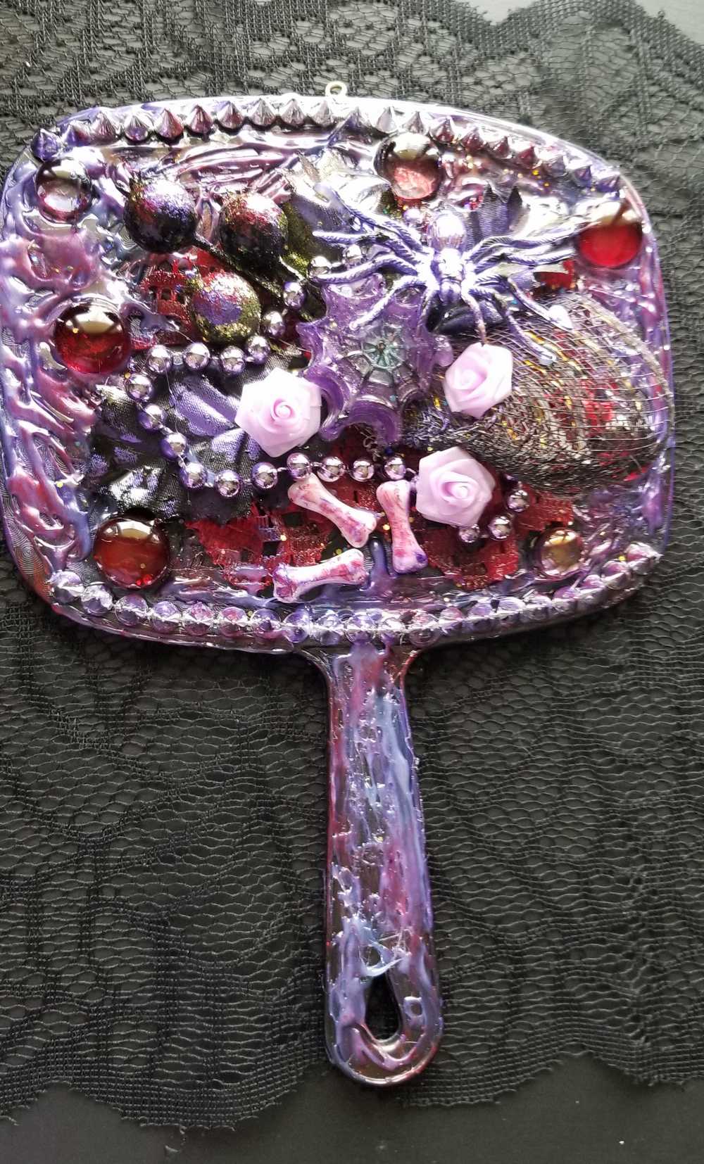 Black Hand Held Mirror with Bones, Roses, a Purple Spider and Her Web