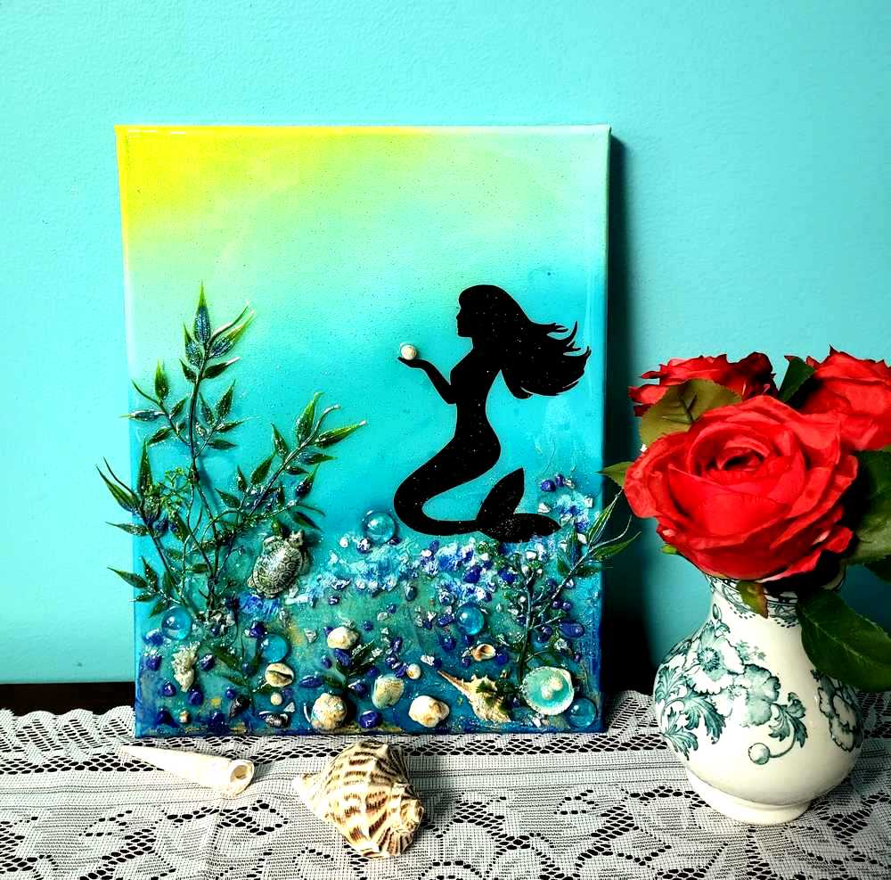 3D Resin Canvas Art of a Beautiful Silhouette of a Mermaid, a Glass Sea Turtle, Seashells, Greenery and Stones