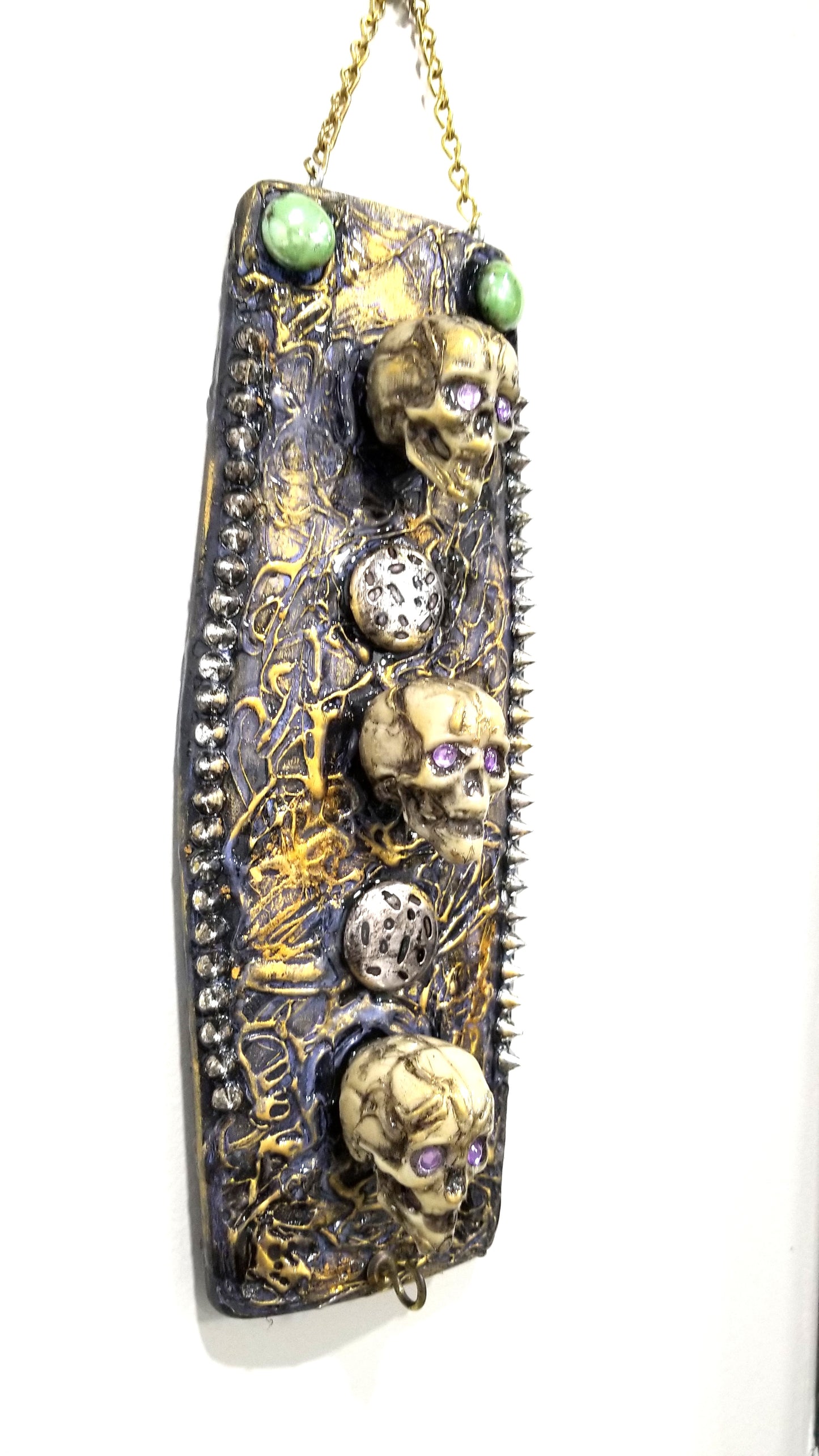 3 Skulls on a Spiked Plaque