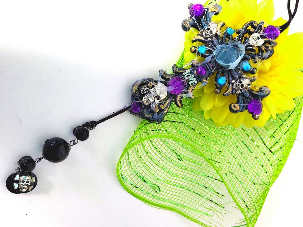 Plastic Cross and Skull Ornament with Teal and Purple Rhinestones