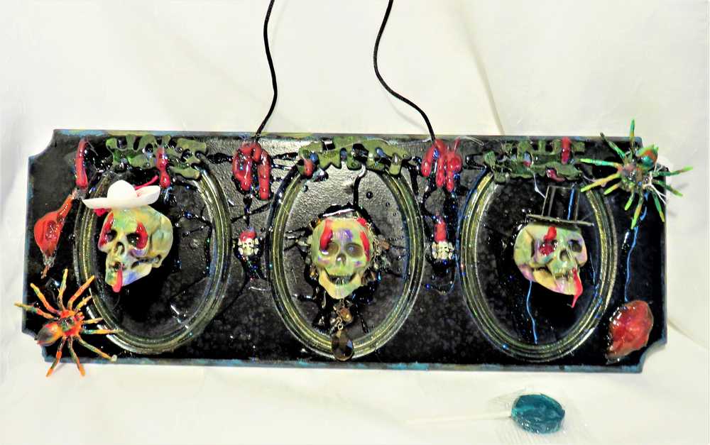 3D Family Portraits of a Handsome Skull Family on a Wall Plaque