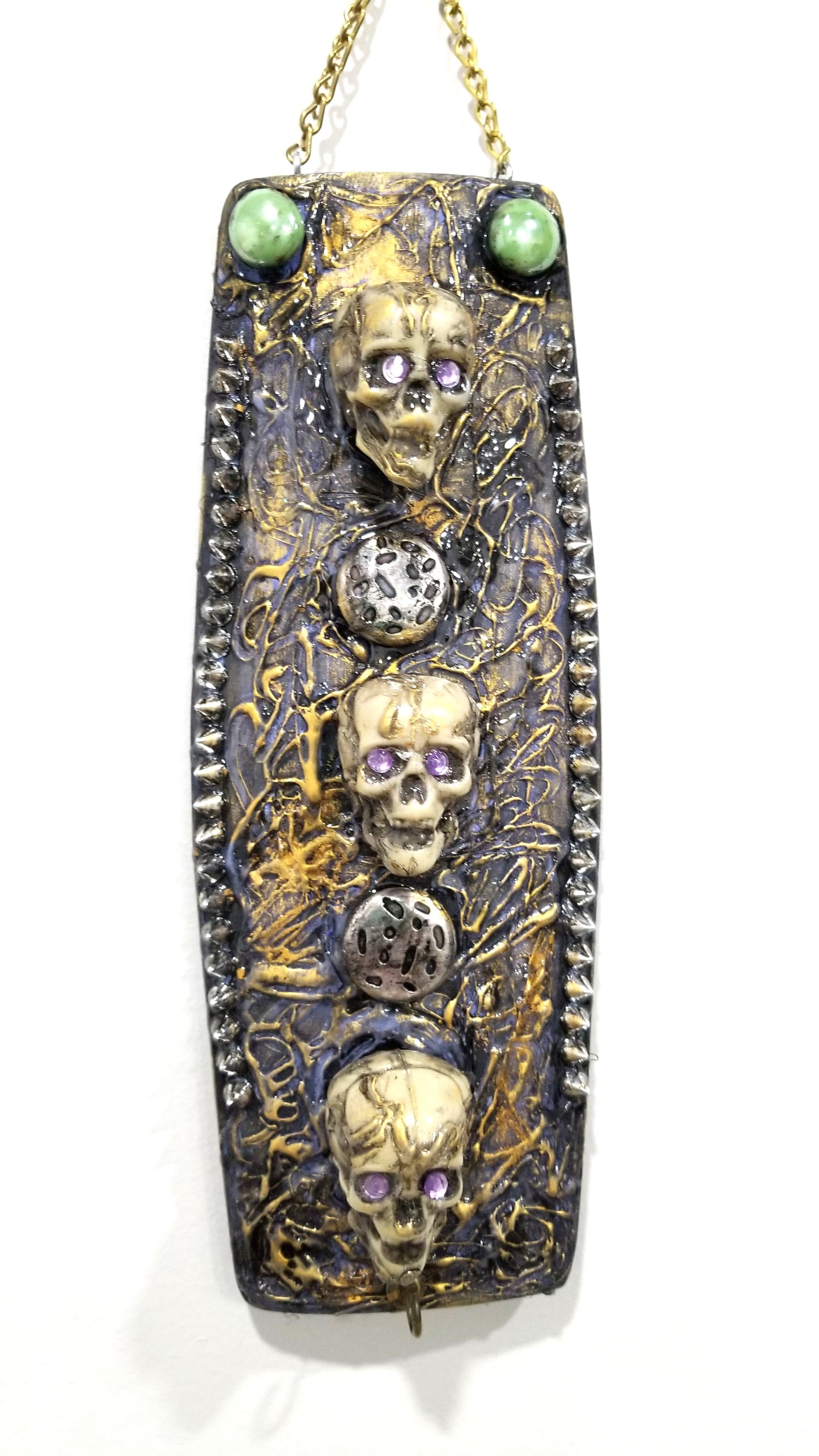 3 Skulls on a Spiked Plaque