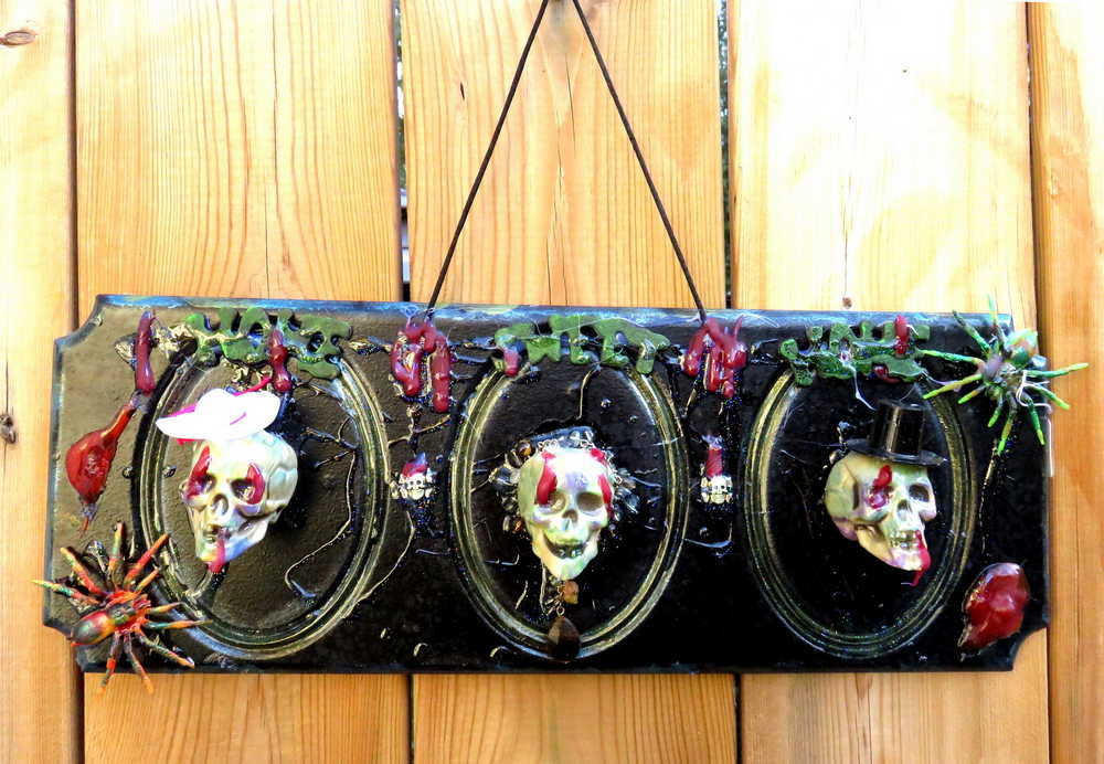 3D Family Portraits of a Handsome Skull Family on a Wall Plaque
