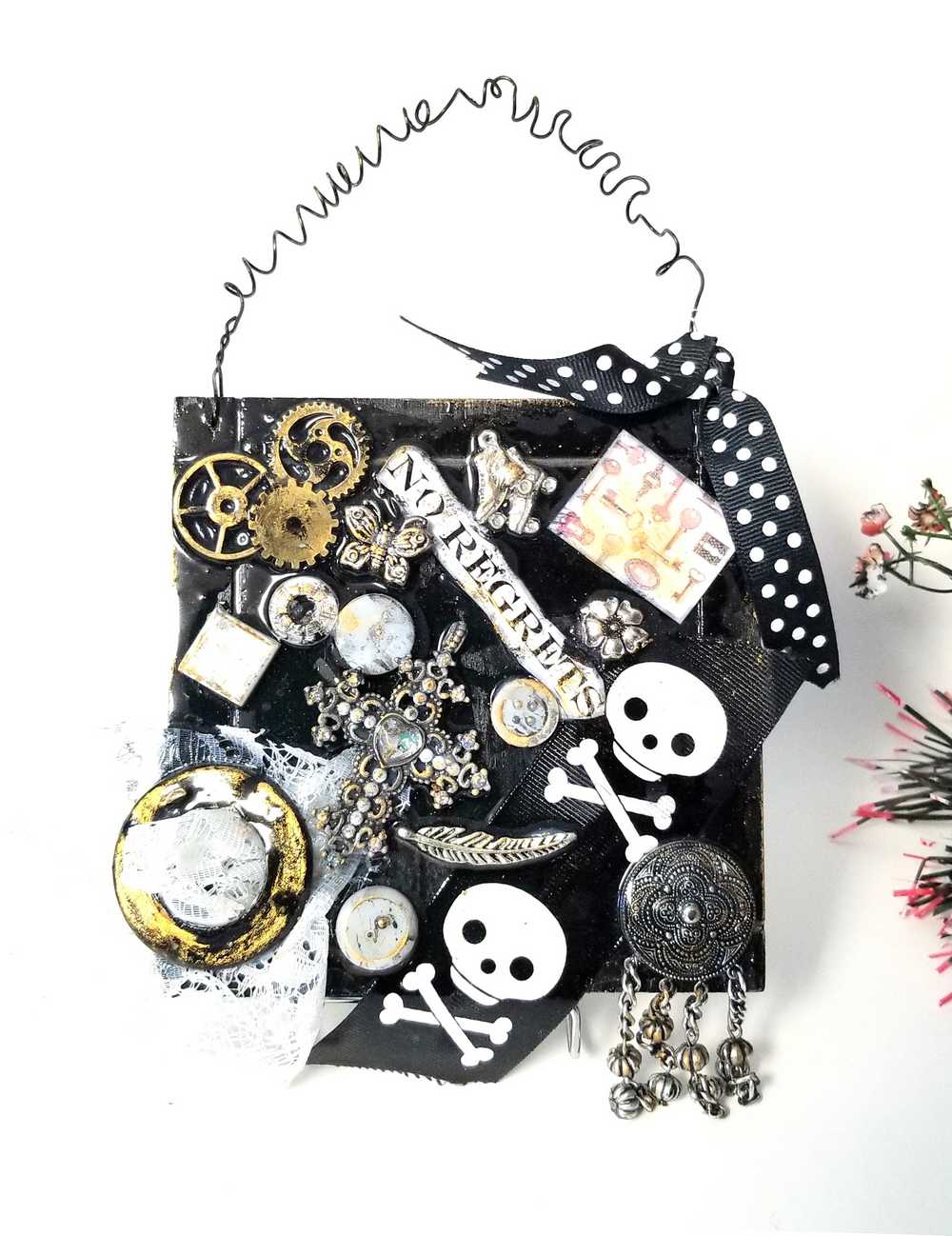 Skull & Bones Wall Plaque in Black & Gold, with Curly Wire Ribbon "No Regrets"