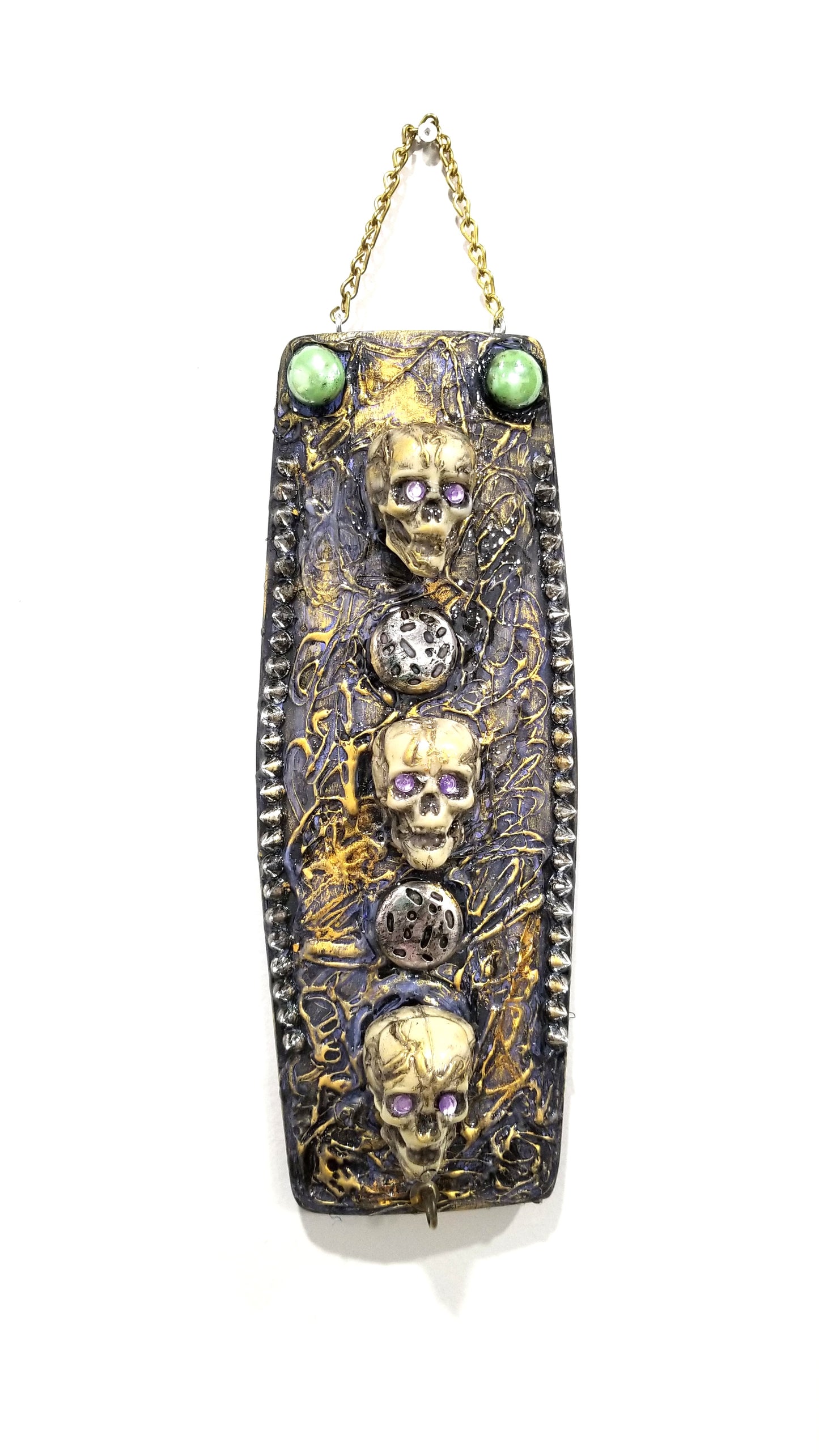 3 Skulls on a Spiked Plaque