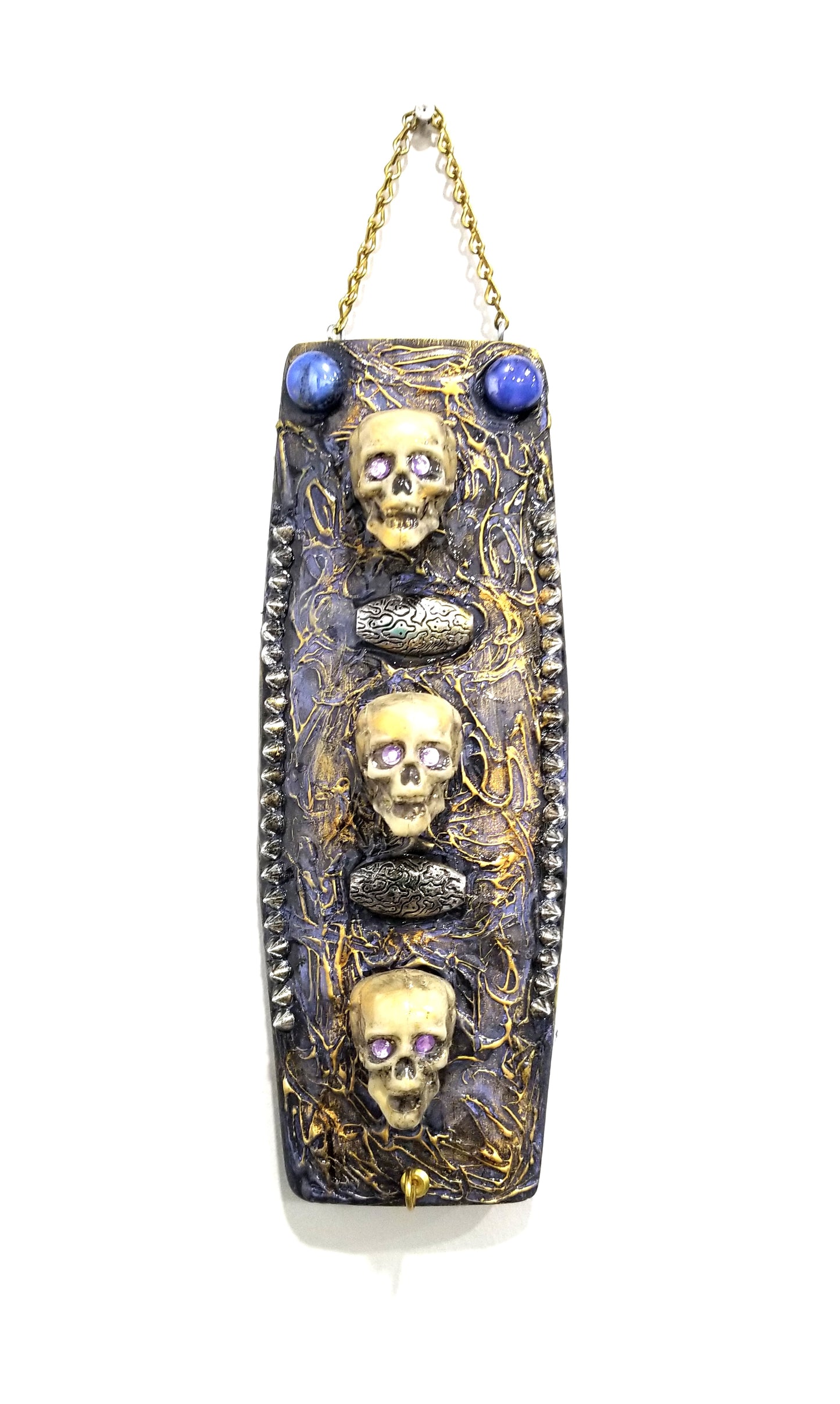 3 Skulls on a Spiked Plaque