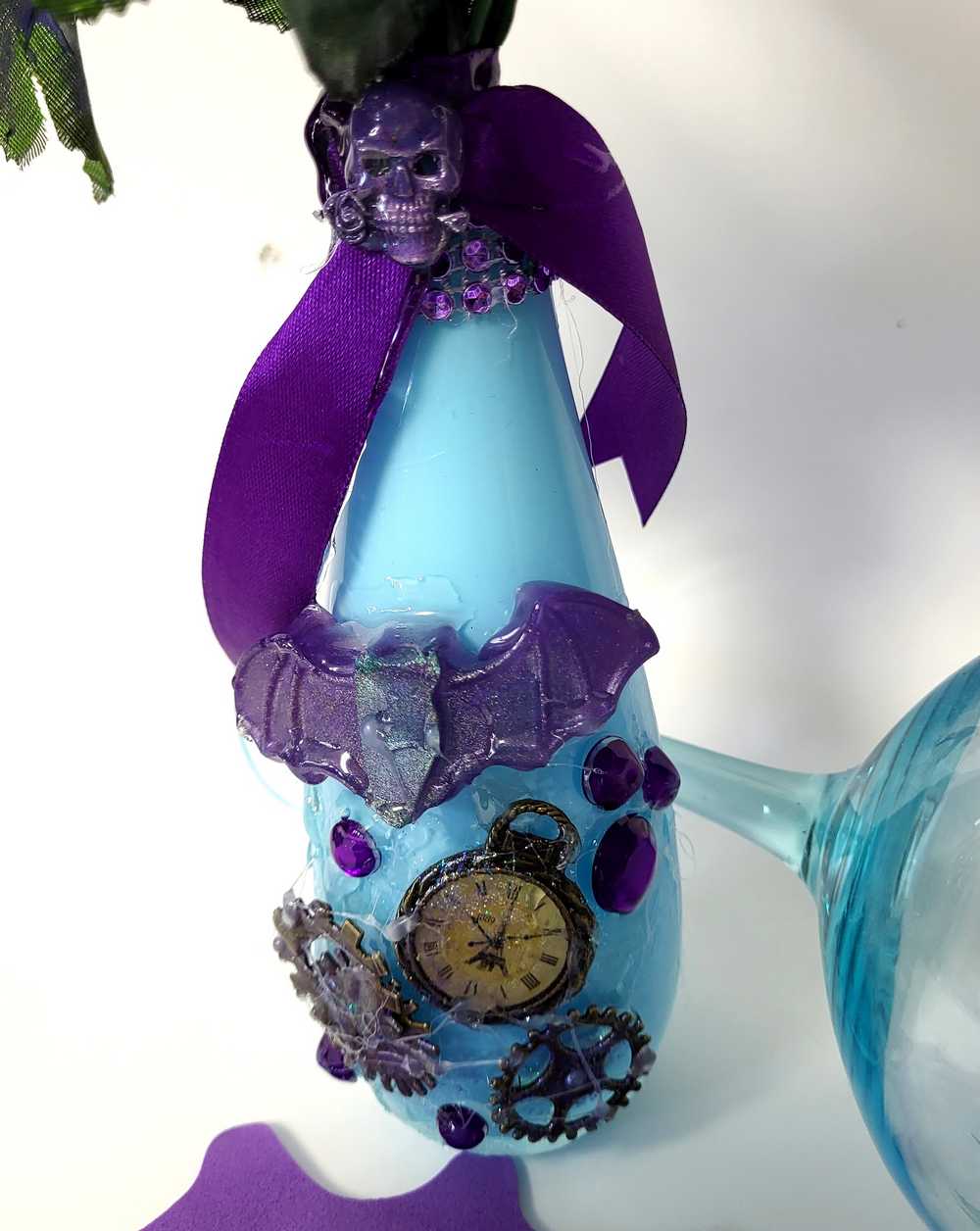 Teal Glass Vase with Skull, Purple Rose and Gears