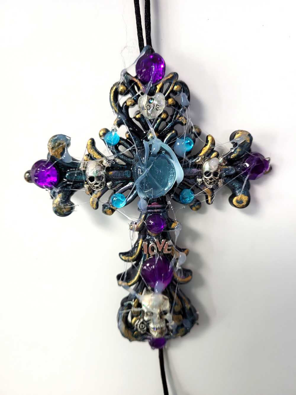 Plastic Cross and Skull Ornament with Teal and Purple Rhinestones