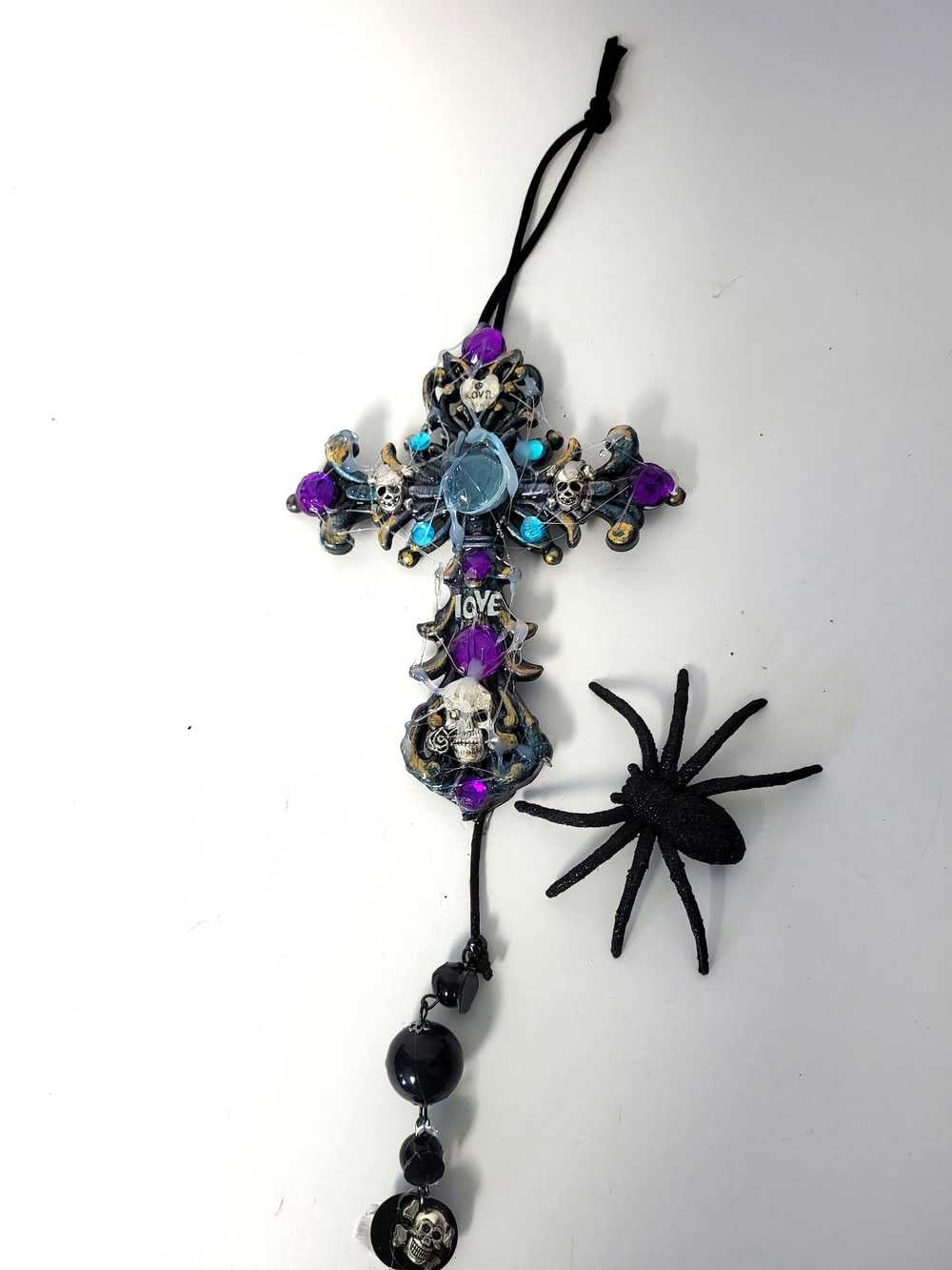 Plastic Cross and Skull Ornament with Teal and Purple Rhinestones