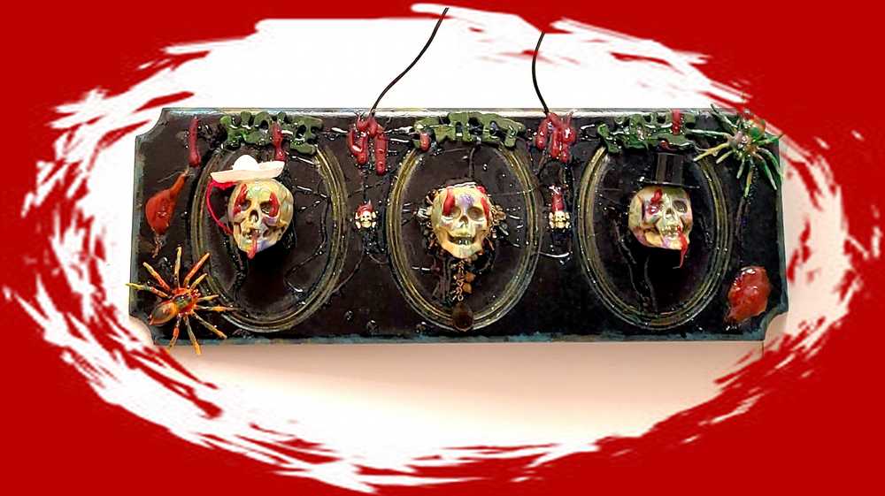3D Family Portraits of a Handsome Skull Family on a Wall Plaque