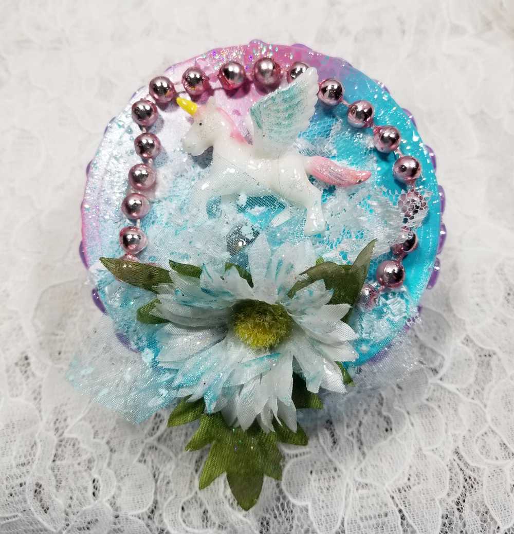 Recycled Round Jewelry Box with a Flying Pink Unicorn and a Daisy