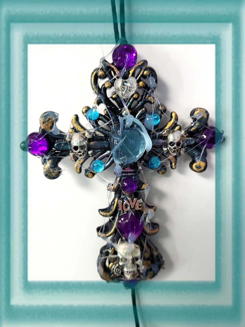 Plastic Cross and Skull Ornament with Teal and Purple Rhinestones