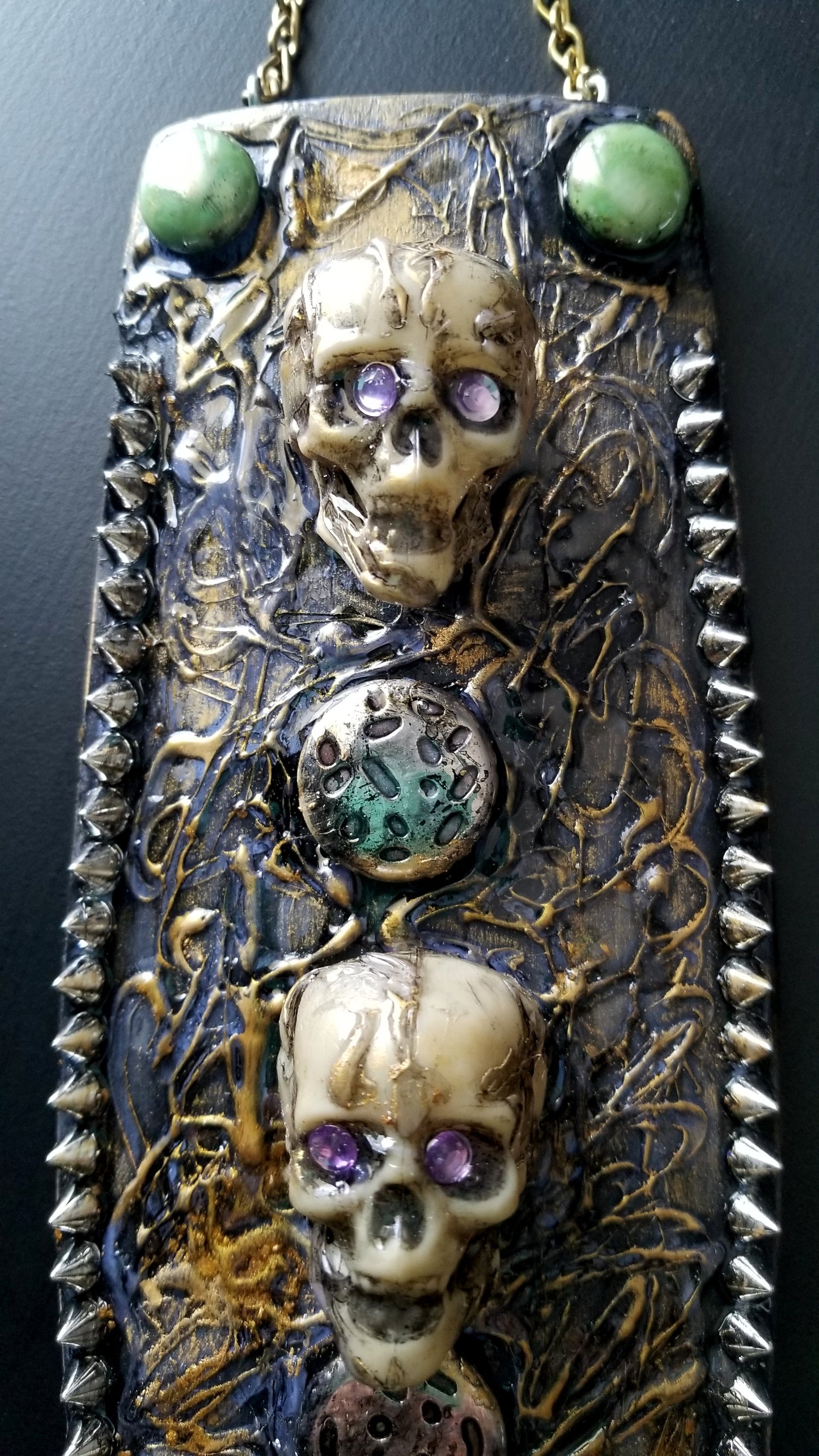 3 Skulls on a Spiked Plaque
