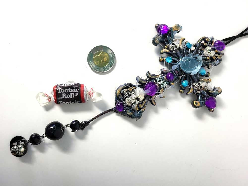 Plastic Cross and Skull Ornament with Teal and Purple Rhinestones