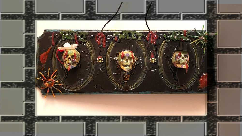 3D Family Portraits of a Handsome Skull Family on a Wall Plaque