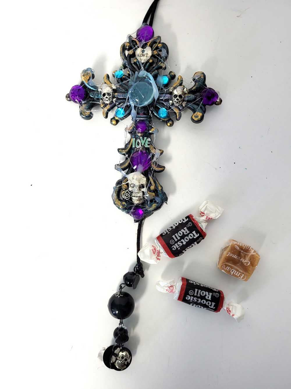Plastic Cross and Skull Ornament with Teal and Purple Rhinestones