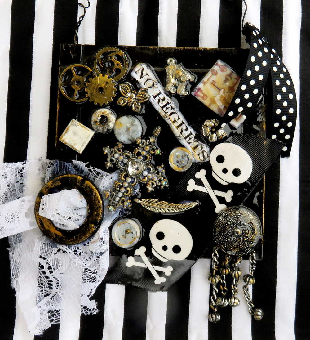 Skull & Bones Wall Plaque in Black & Gold, with Curly Wire Ribbon "No Regrets"