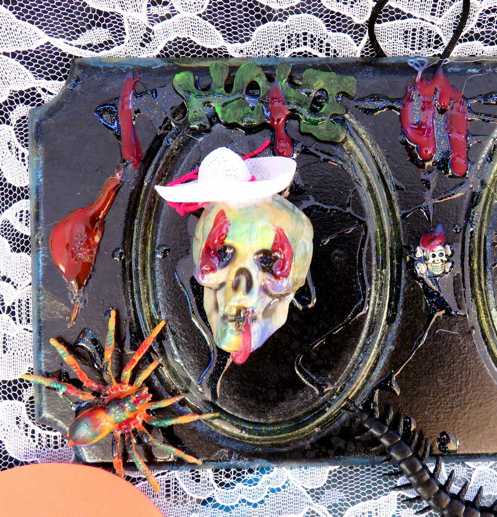 3D Family Portraits of a Handsome Skull Family on a Wall Plaque