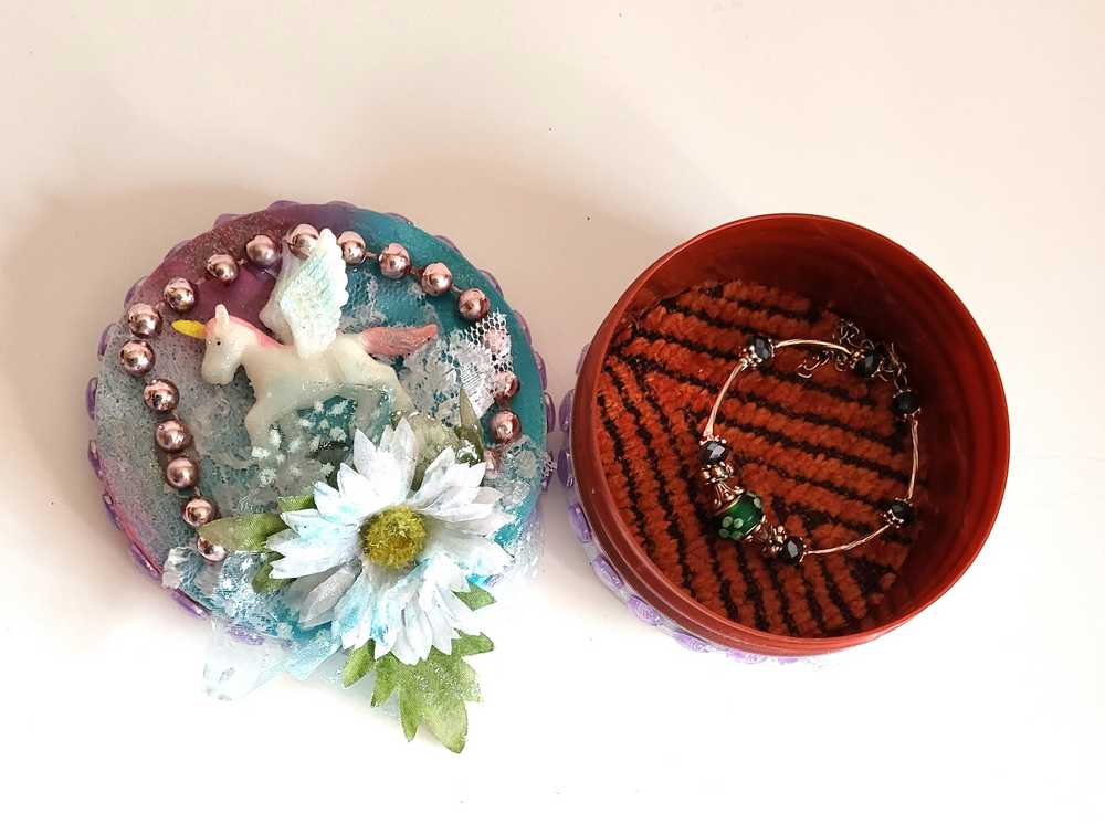 Recycled Round Jewelry Box with a Flying Pink Unicorn and a Daisy