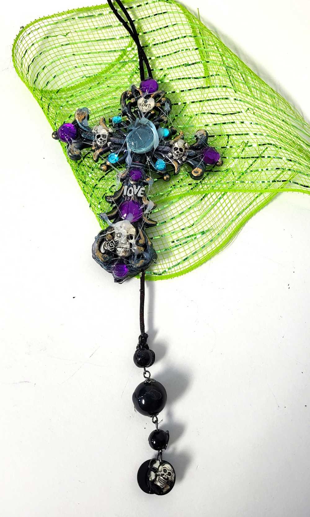 Plastic Cross and Skull Ornament with Teal and Purple Rhinestones