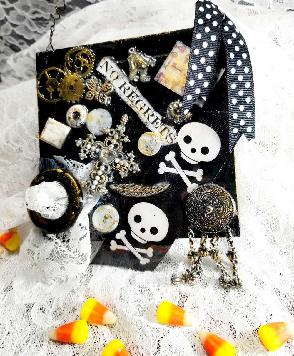 Skull & Bones Wall Plaque in Black & Gold, with Curly Wire Ribbon "No Regrets"