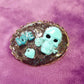 Porcelain Black Oval Shaped Brooch with Hand Painted Teal Skull, Heart & Love Charms