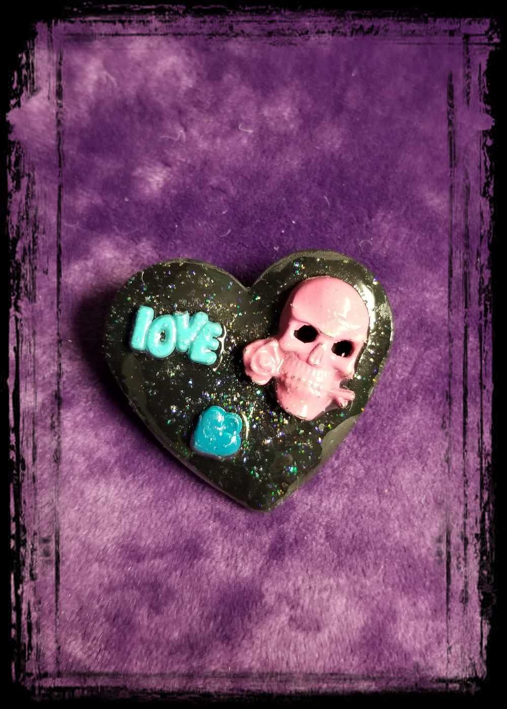 Black Porcelain Heart Shaped Brooch with a Pink Skull and a Teal Heart & Love Charm