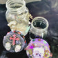 1 litre Mason Jar Filled with Hard Candy. With a Wooden Lid with Resin Skulls & a Cross