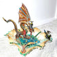 Fire-Breathing Dragon in Antique Glass Dish in a Fierce Fight for Survival