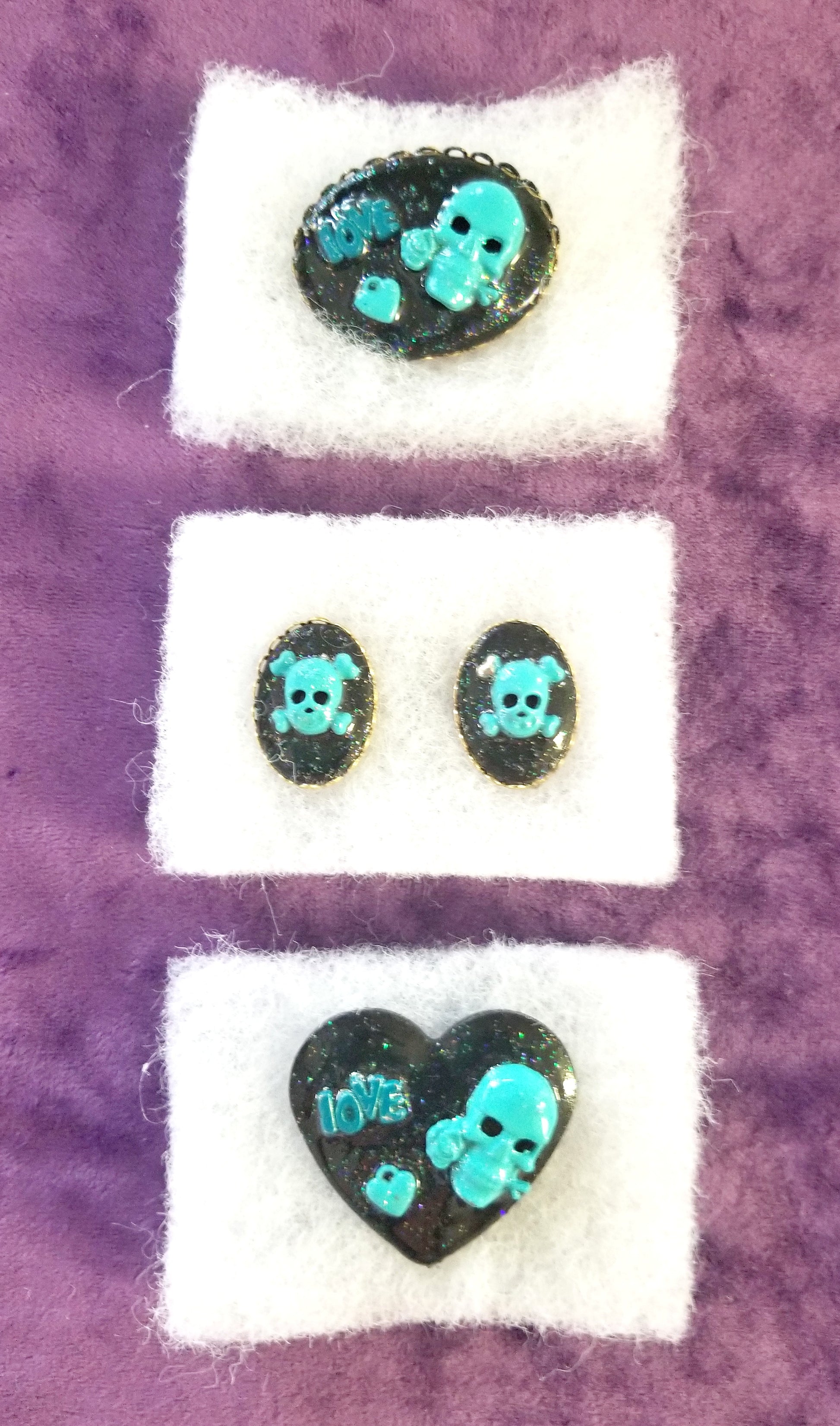 Black Porcelain Heart Shaped Brooch with a Teal Skull, Love and a Heart Charm