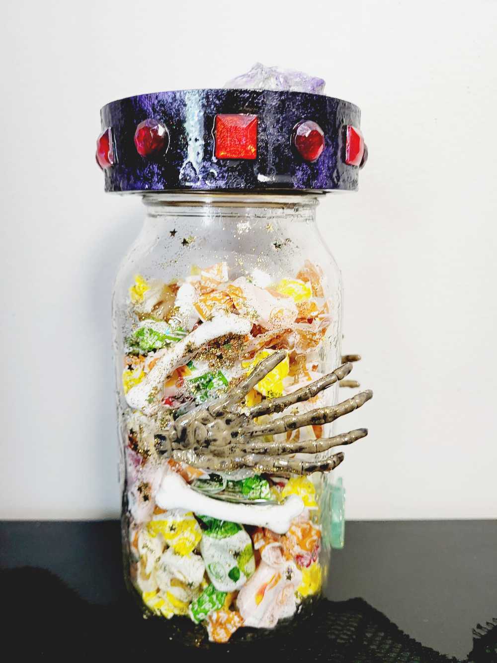 1 litre Mason Jar Filled with Hard Candy. With a Wooden Lid with Resin Skulls & a Cross