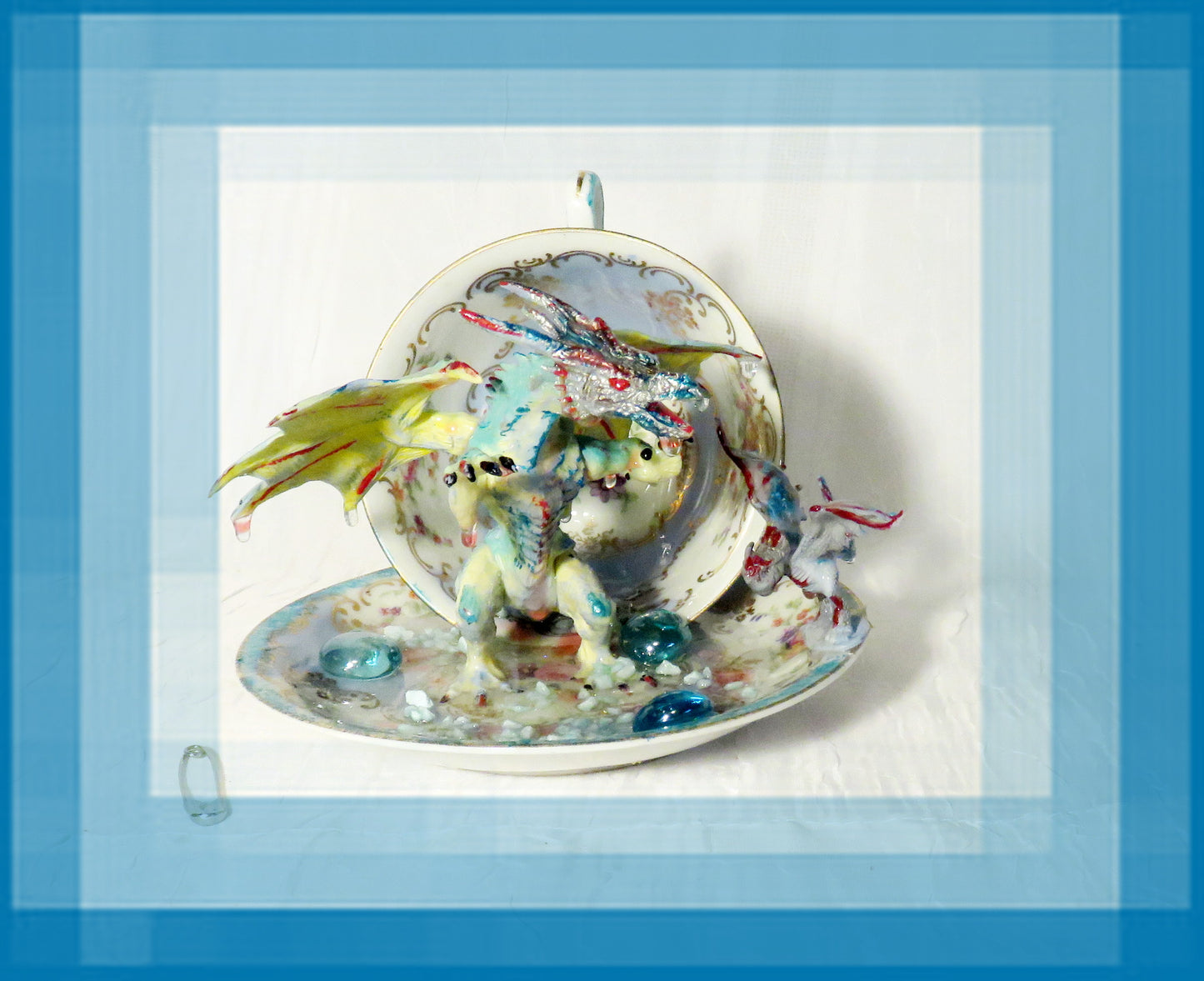 Fighting Dragons in a Vintage Teacup and Saucer Encased in Resin