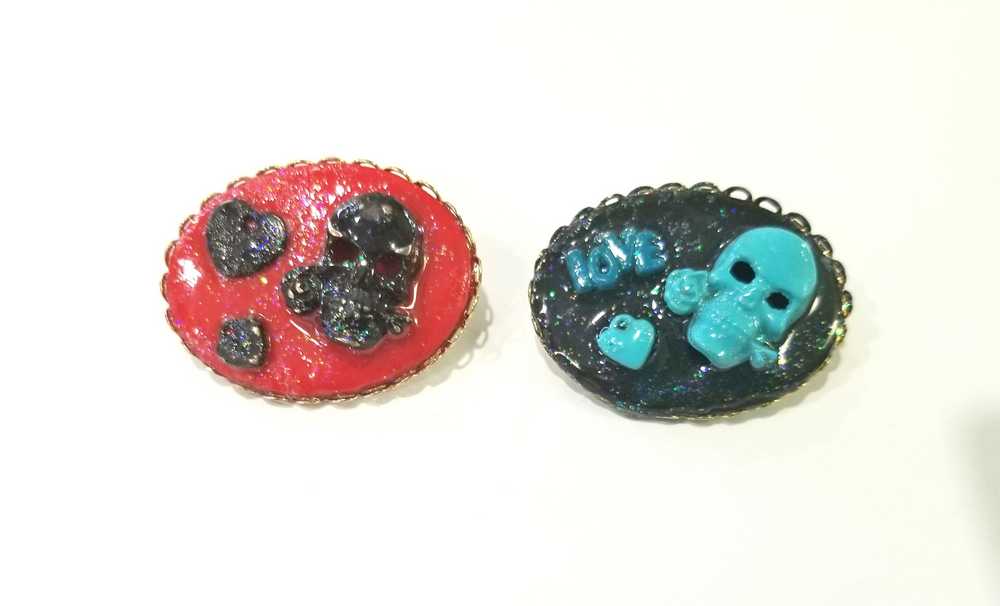 Porcelain Black Oval Shaped Brooch with Hand Painted Teal Skull, Heart & Love Charms